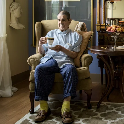 A St. Margaret's resident enjoying a cup of tea in his personalized private room